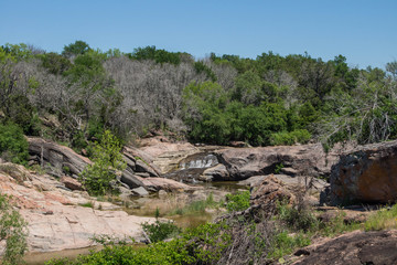 Water cascade of Colorado river in Inks Lake State Park, Texas