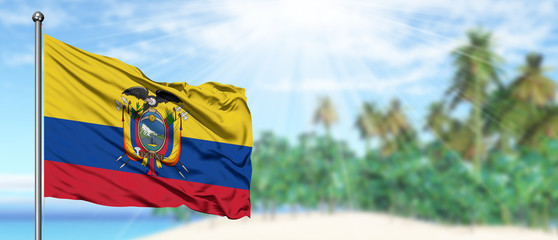 Waving Ecuador flag in the sunny blue sky with summer beach background. Vacation theme, holiday concept.