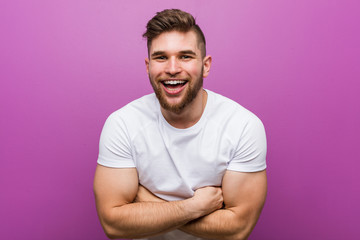 Obraz premium Young handsome caucasian man laughing and having fun.