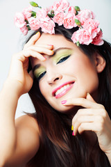 Obraz na płótnie Canvas young pretty brunette woman with pink flowers and manicure posing cheerful isolated on white background closeup