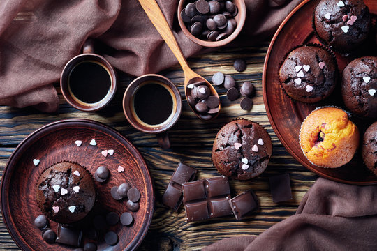 chocolate muffins on a plate and black coffee