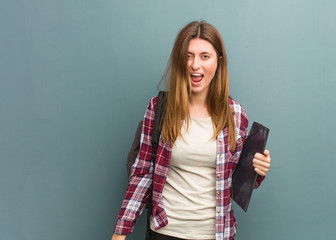 Fototapeta premium Young student russian woman screaming very angry and aggressive