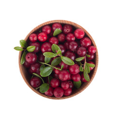 fresh red cowberry in wooden cup isolated on white background