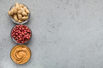 Bowls with peanuts and peanut butter