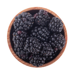 heap of blackberry in wooden cup isolated on white background