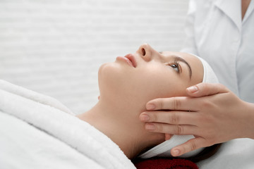 Massage of face for health and beauty in medical center.
