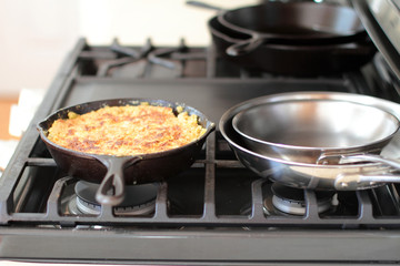 Peach cobbler in a cast iron skillet fresh out of the oven.