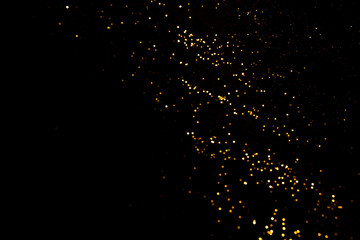 Gold abstract bokeh. Black background. Holyday concept
