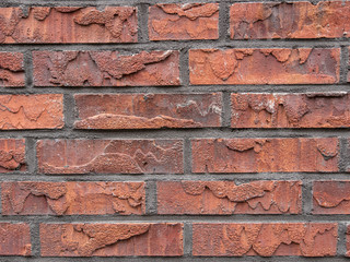 Old repaired weathered brick wall for background