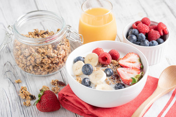 pouring milk in granola, breakfast image