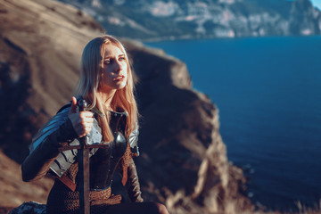 The cute female warrior attacking with sword