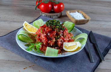 Turkish Shepherd salad. ( Turkish; Çoban Salatası ) Tomato, pepper, onion, arugula, parsley and lemon with