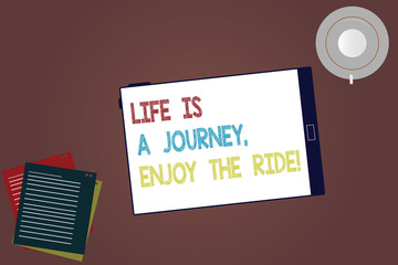 Word writing text Life Is A Journey Enjoy The Ride. Business concept for Enjoying things that happen everyday Tablet Empty Screen Cup Saucer and Filler Sheets on Blank Color Background