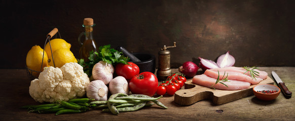 fresh turkey meat steaks with rosemary and ingredients for cooking