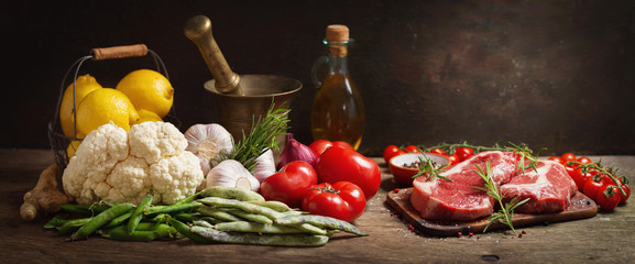 resh meat with rosemary and ingredients for cooking