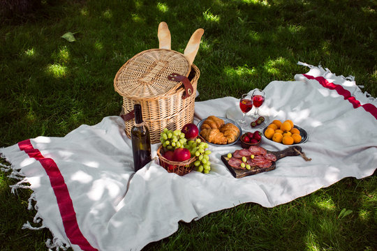 Summer picnic in the park on the green grass