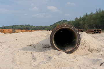 Big drain pipe on the beach