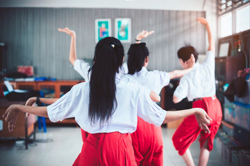Asian young girl uniform students learning Thai dance