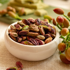 Sweet, delicate and fragrant nuts, Bronte pistachios with  brilliant green colour, ingredient for Italian cuisine, ice creams, cakes, pesto