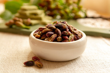 Sweet, delicate and fragrant nuts, Bronte pistachios with  brilliant green colour, ingredient for Italian cuisine, ice creams, cakes, pesto