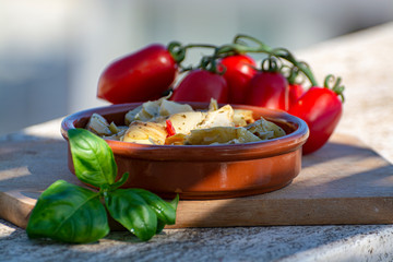 Italian food, marinated artichokes hearts with herbs and garlic