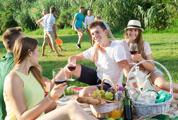 Parents with kids enjoying picnic