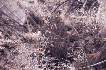 Texture abstract closeup background ice with bubbles of air caught by frost in the mass of water...