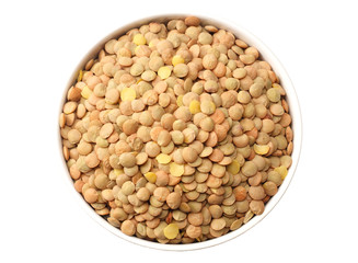 lentils in a white plate isolated on white background. top view