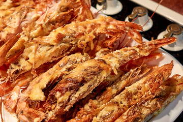 Tasty deep-fried shrimps right from the oven close-up
