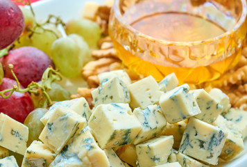 Cheese, grapes, walnuts and honey gourment assorted