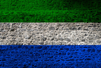 National flag colored depicted in paint on a man's face close-up, isolated on a white background