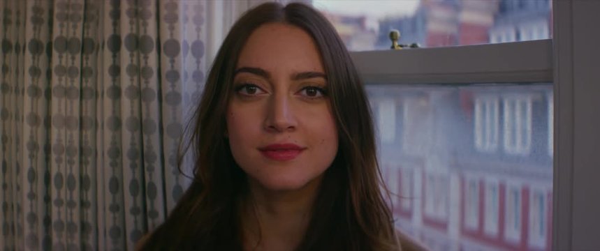 Woman blinking and smiling looking at camera