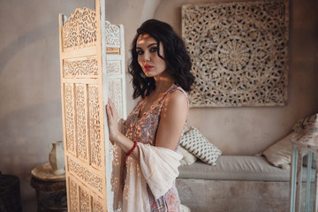 Woman posing in traditional morrocan living room