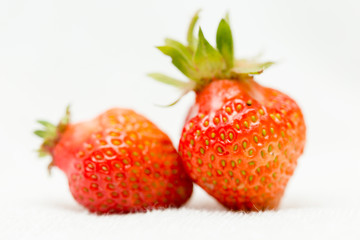 Strawberries on a white background, fresh, tasty and natural strawberries from the garden of his grandfather.
