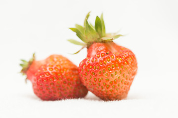 Strawberries on a white background, fresh, tasty and natural strawberries from the garden of his grandfather.