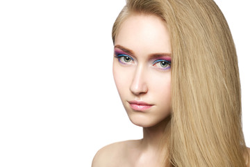 Portrait of a beautiful young blond girl with long hair and stylish pastel make-up. Spring image. Natural beauty