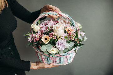 bouquet of flowers in a wooden basket