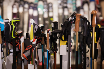 Assortment of ski poles in foreground