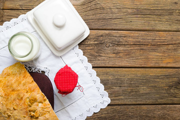 breakfast jam milk half bread on old wooden