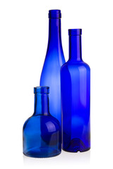 Three blue glass bottles
