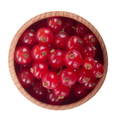 heap of red currants in wooden cup isolated on white background. top view