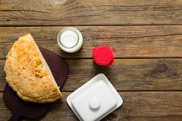 breakfast jam milk half bread on old wooden