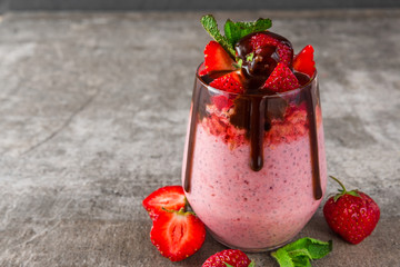 healthy delicious breakfast. strawberry chia seed pudding with chocolate, fresh berries and mint.