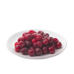 heap of cherry in plate isolated on white