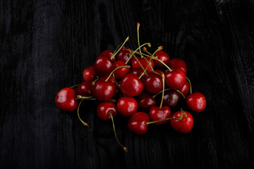 heap of cherry on wooden background