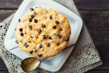 Cake in mug with peanut butter and chocolate chips