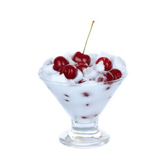 heap of cherry in cream in cup isolated on white