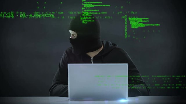 Hacker using a laptop