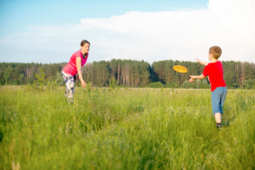 Mom and son play frisbee, Chernigov, Ukraine, May 30, 2019.