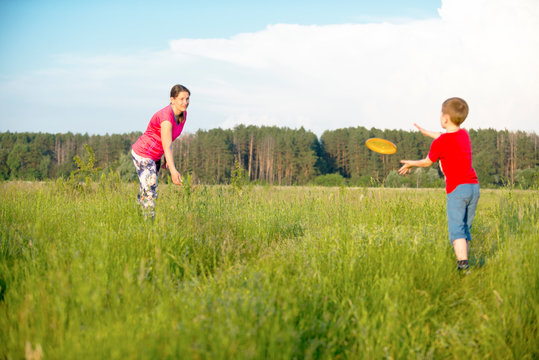 Mom and son play frisbee, Chernigov, Ukraine, May 30, 2019.